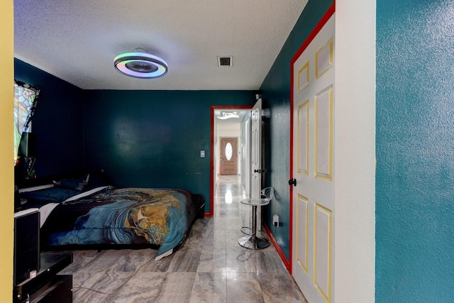 bedroom with a textured ceiling