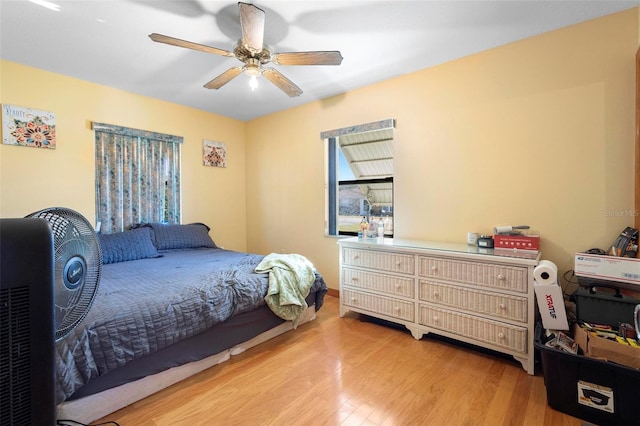 bedroom with ceiling fan and light wood-type flooring