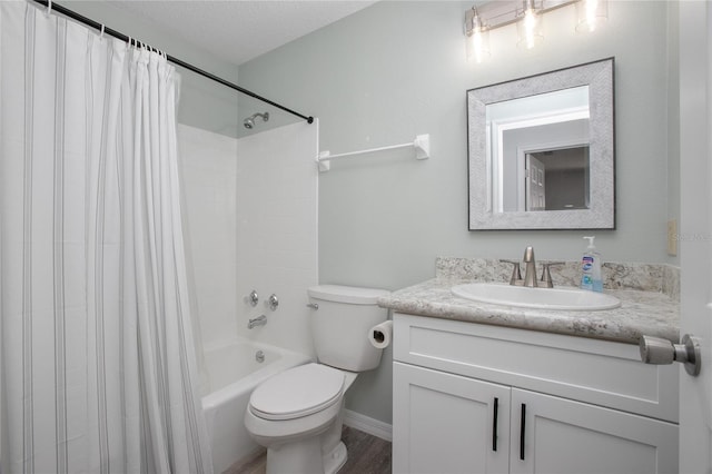 full bathroom featuring toilet, vanity, hardwood / wood-style floors, shower / bathtub combination with curtain, and a textured ceiling