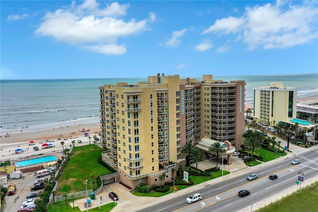 bird's eye view featuring a view of the beach and a water view