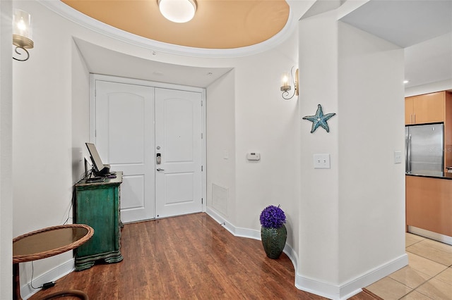 entryway with hardwood / wood-style floors