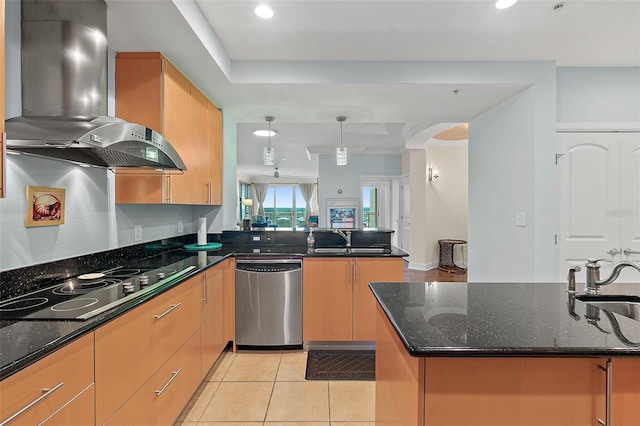 kitchen with hanging light fixtures, stainless steel dishwasher, ventilation hood, and dark stone counters