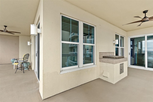 view of patio / terrace featuring ceiling fan