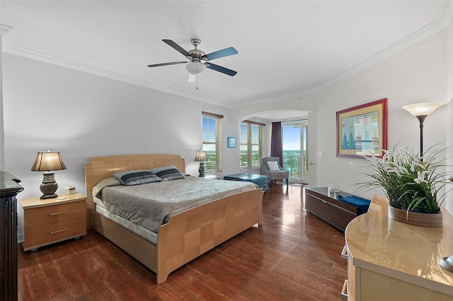 bedroom with ceiling fan, ornamental molding, and dark hardwood / wood-style flooring