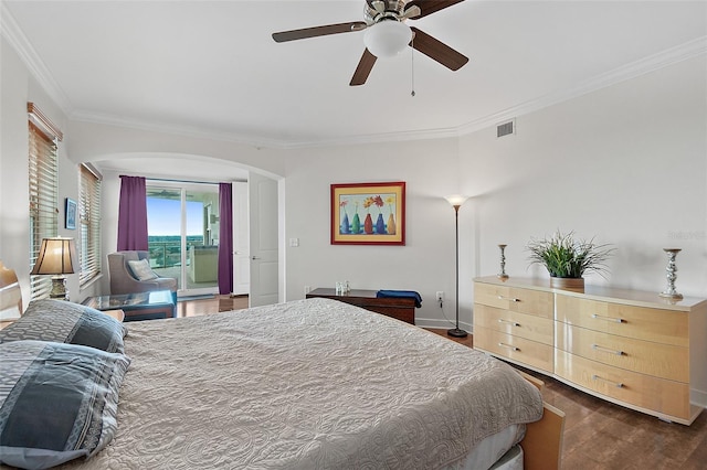 bedroom featuring ceiling fan, access to exterior, ornamental molding, and dark wood-type flooring