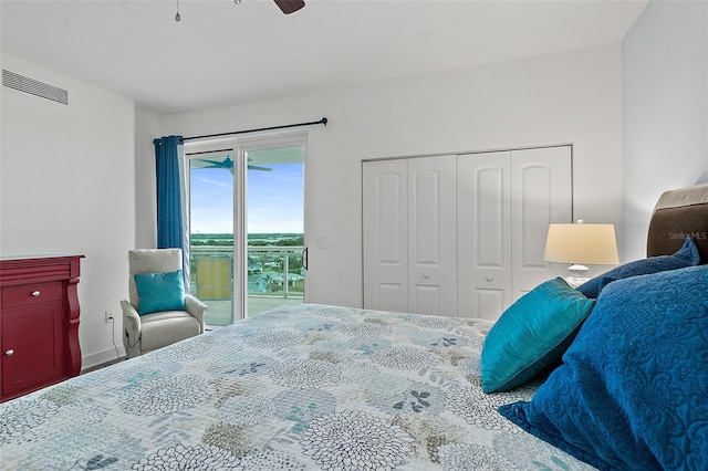 bedroom with access to outside, ceiling fan, and a closet