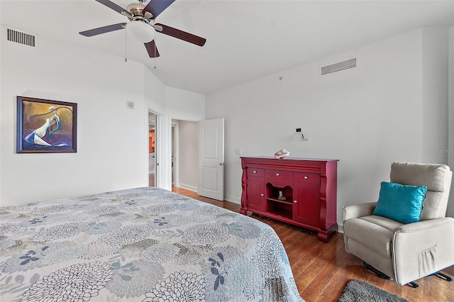 bedroom with ceiling fan and dark hardwood / wood-style floors