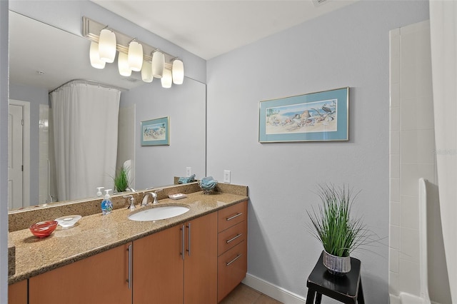 bathroom featuring tile patterned flooring and vanity