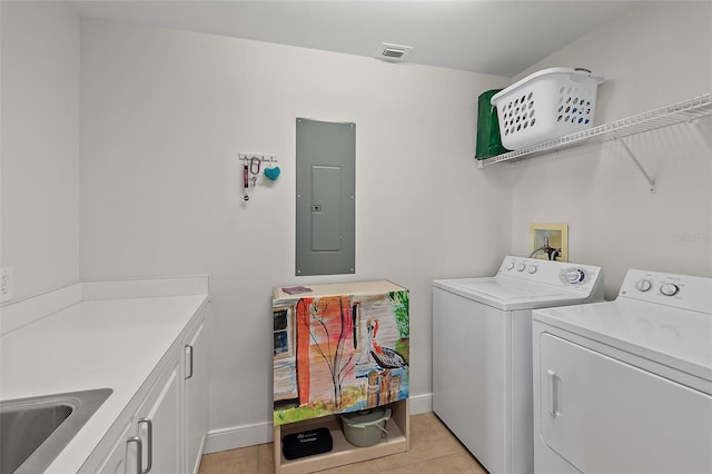 laundry room with light tile patterned floors, separate washer and dryer, cabinets, electric panel, and sink