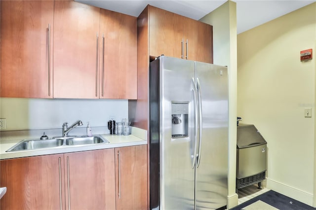 kitchen with sink and stainless steel fridge