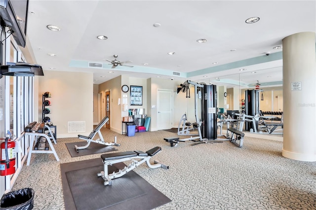 gym featuring ceiling fan and carpet flooring