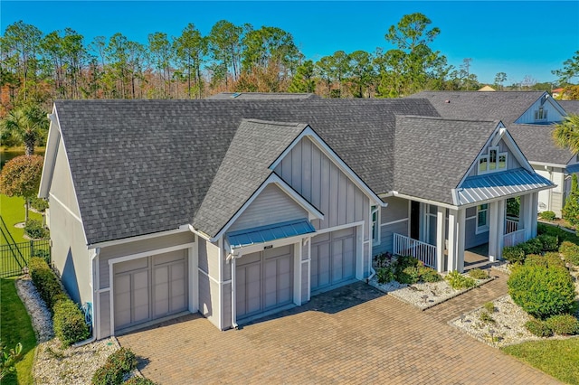 view of front of house with a garage and covered porch