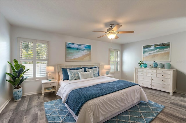 bedroom with dark wood-type flooring and ceiling fan