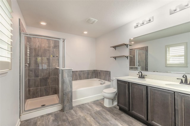 full bathroom with toilet, vanity, hardwood / wood-style flooring, and shower with separate bathtub