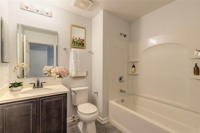 full bathroom with toilet, vanity, wood-type flooring, shower / bath combination, and a textured ceiling