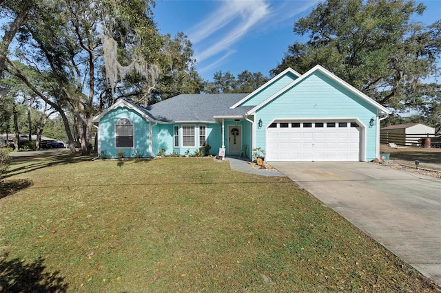 ranch-style house featuring a garage and a front lawn