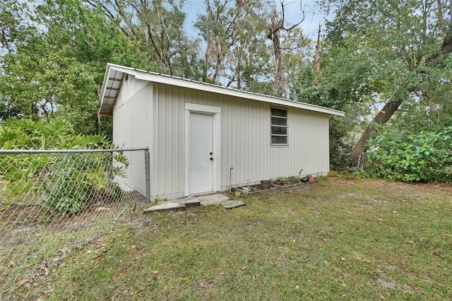 view of outdoor structure with a lawn