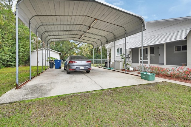 view of vehicle parking with a lawn