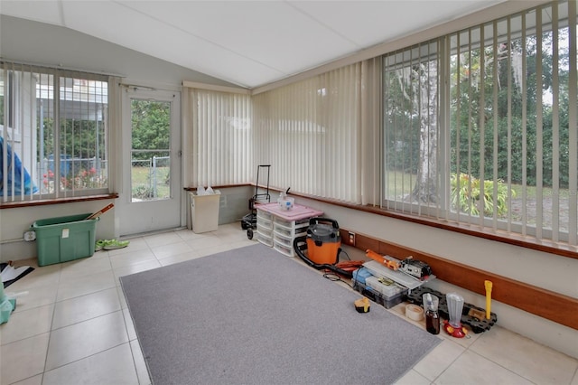 sunroom / solarium featuring lofted ceiling