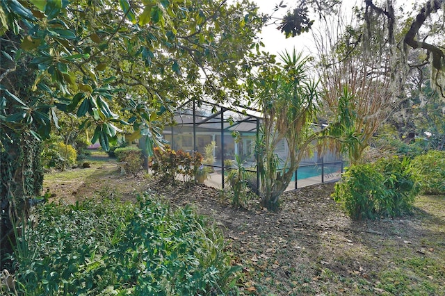 view of yard featuring a lanai