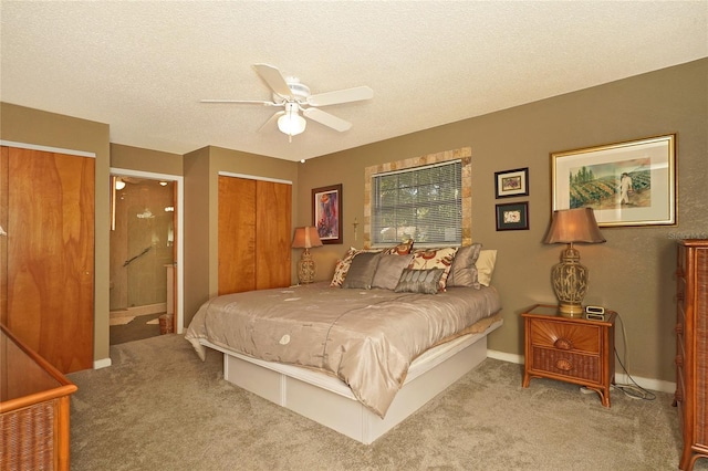 carpeted bedroom with ceiling fan, connected bathroom, and a textured ceiling