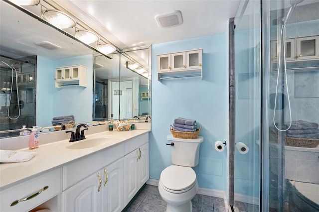 bathroom featuring a shower with shower door, toilet, and vanity