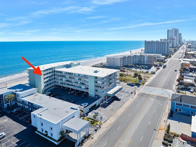 aerial view featuring a water view and a view of the beach