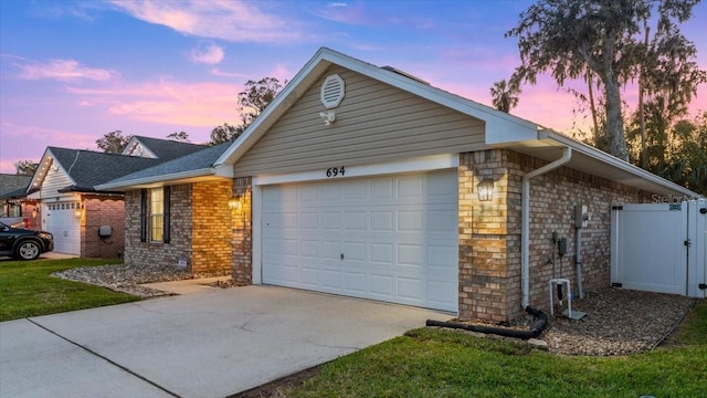 ranch-style house featuring a garage