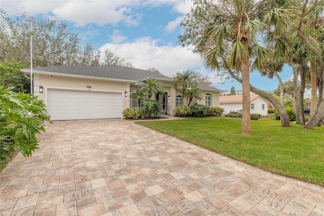 ranch-style home with a garage and a front lawn