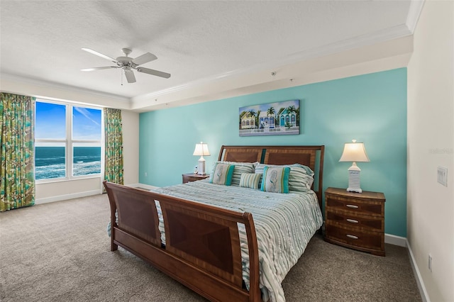 bedroom featuring ceiling fan, carpet flooring, a water view, and ornamental molding