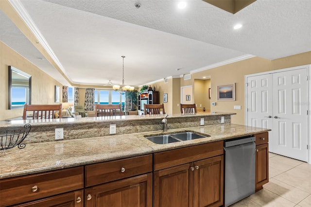 kitchen with stainless steel dishwasher, sink, light tile patterned flooring, a textured ceiling, and light stone counters