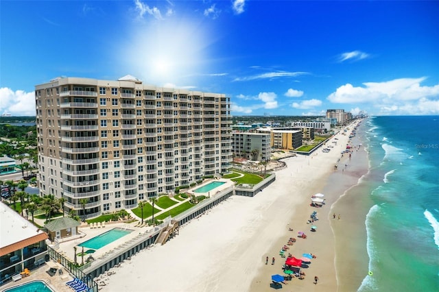 bird's eye view featuring a beach view and a water view