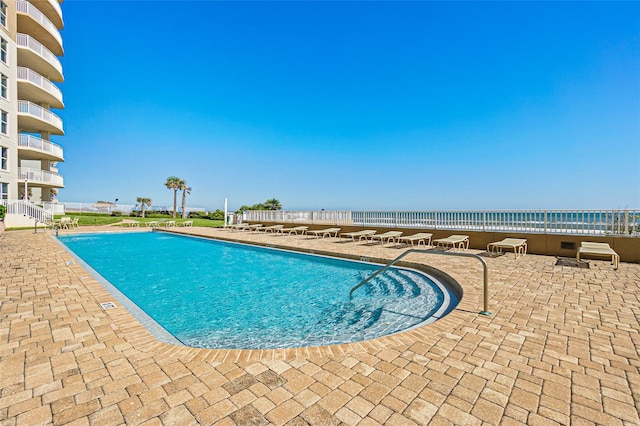 view of pool featuring a patio