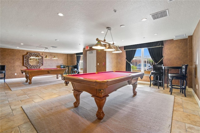 playroom with billiards and a textured ceiling