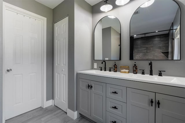 bathroom featuring vanity and hardwood / wood-style flooring