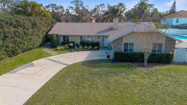 ranch-style home with a front yard