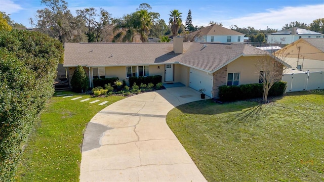 ranch-style house featuring a garage and a front lawn