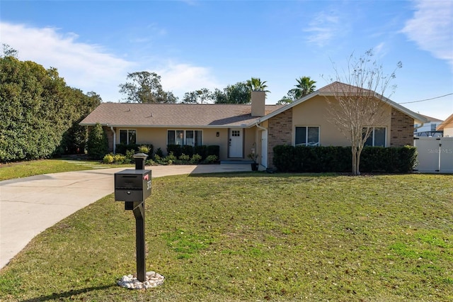 ranch-style house featuring a front lawn