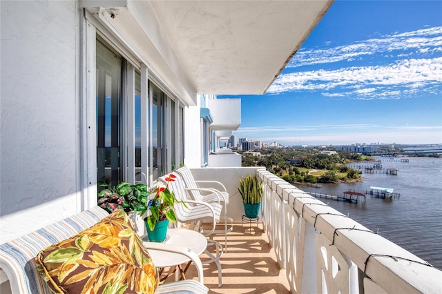 balcony featuring a water view