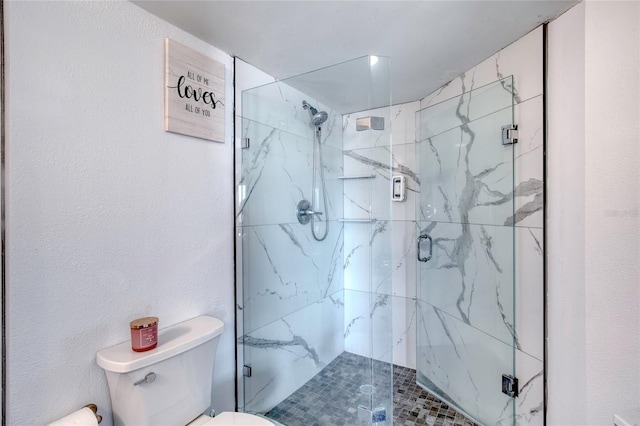 bathroom with walk in shower and toilet