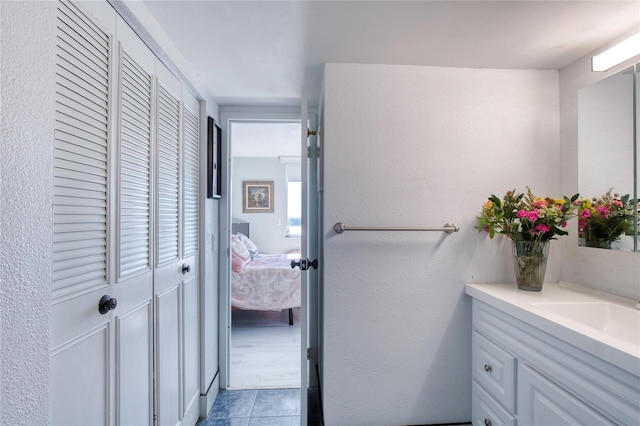 bathroom featuring vanity and tile patterned flooring