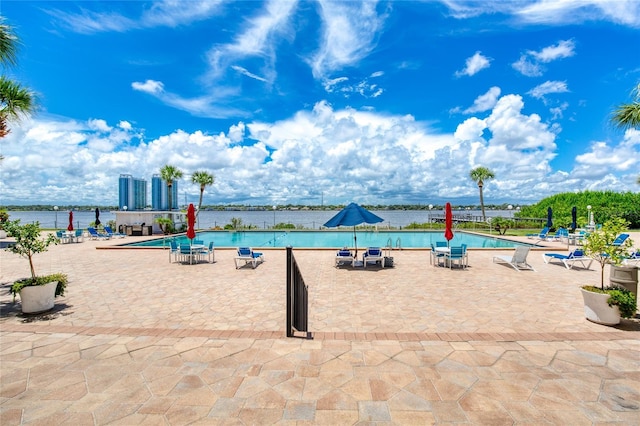 exterior space featuring a water view and a patio