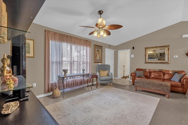 living room featuring ceiling fan and vaulted ceiling