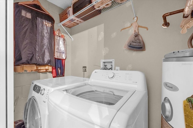 washroom with separate washer and dryer and water heater