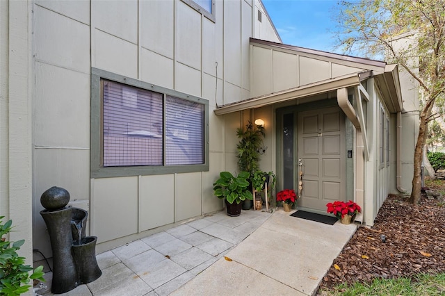 property entrance featuring a patio