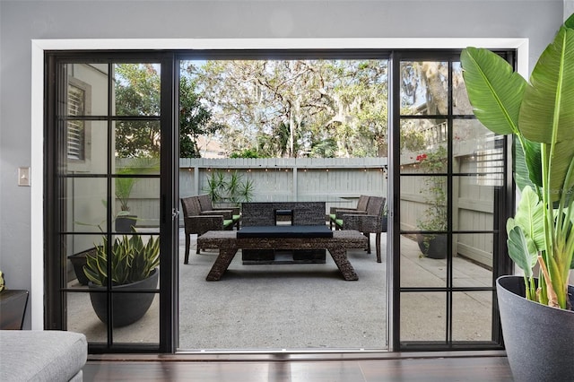 doorway to outside with hardwood / wood-style flooring