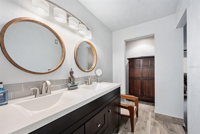 bathroom with wood-type flooring and vanity