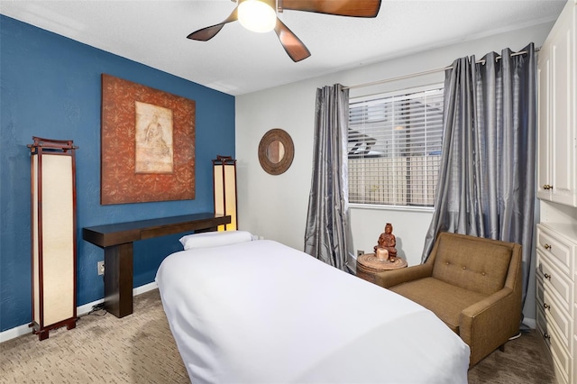 bedroom featuring ceiling fan and light carpet