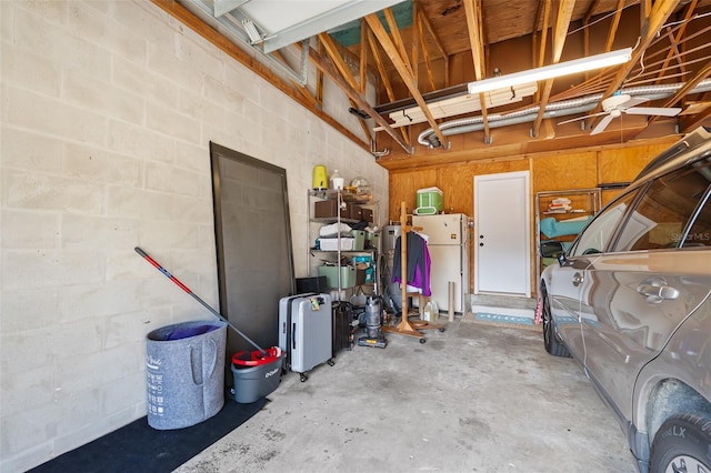 garage with white refrigerator