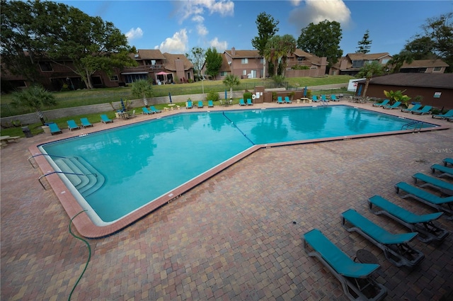 view of swimming pool with a patio area